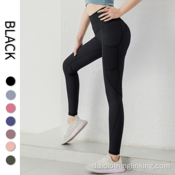 Kvinders yoga leggings med sidelommer